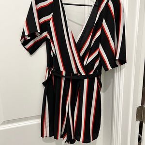 Size medium romper. Worn once in picture